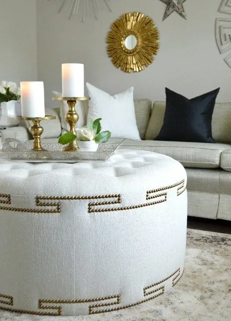 Crafting an Elegant Ottoman with Decorative Nailhead Design 1 A stunning ottoman that enhances your decor with nailhead details.