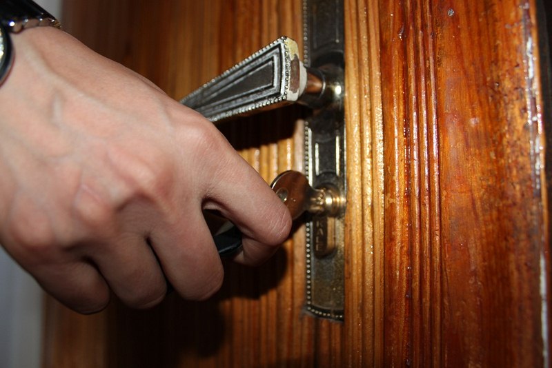 Hand Unlocking a Door Green Home Buyers Guide: - How to Buy an Eco-Friendly House