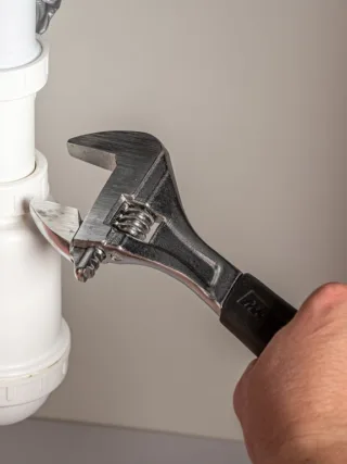 featured image - How to Save Money on Plumbing Repairs