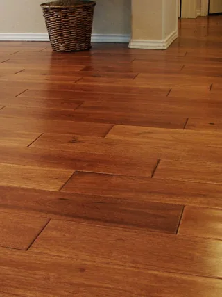 featured image - The Ultimate Guide to Choosing Between Engineered and Solid Wood Flooring