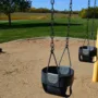 featured image - The Best Material to Use Under a Swingset